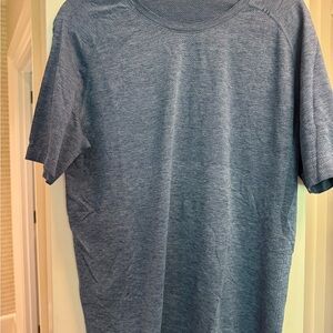 2 shirts: 1 Large lululemon Blue Short Sleeve Tee and 1 XL Myles men’s tee